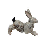 Bali bounding wooden rabbit, handmade jointed folk-art figure mid-leap
