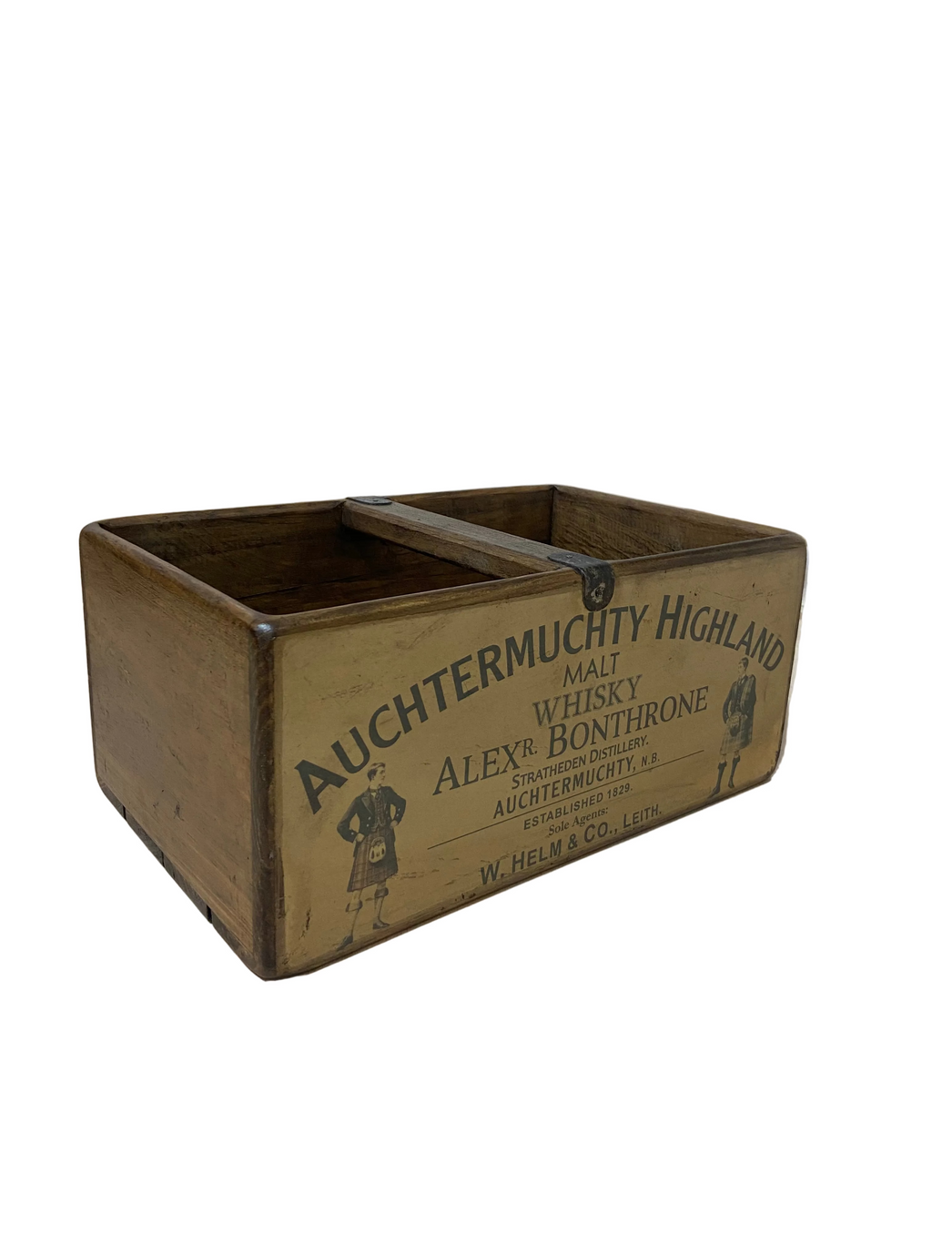 Vintage wooden crate with 'Auchtermuchty Highland' branding on a concrete floor.