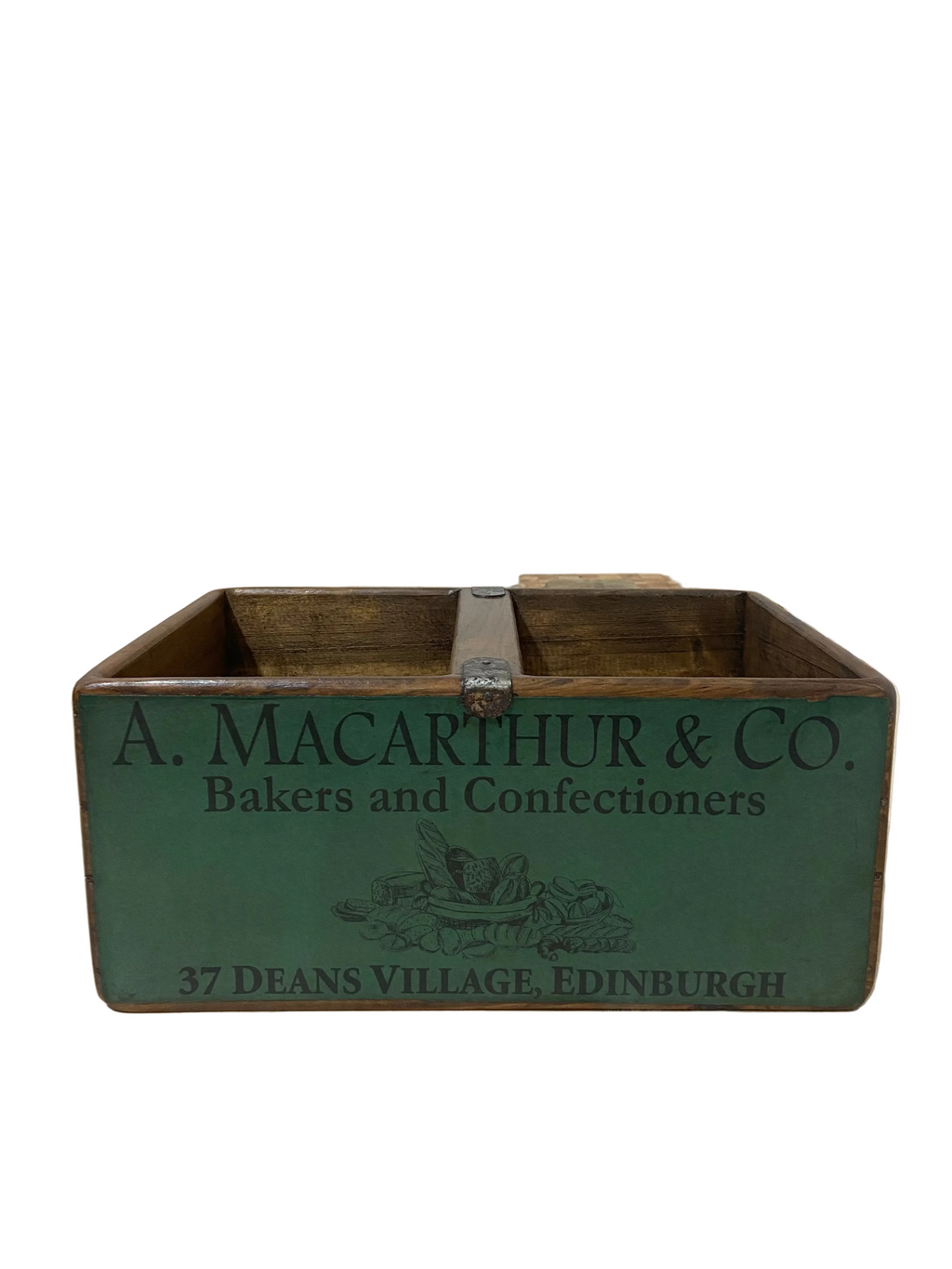 Vintage wooden box with 'A. Macarthur & Co.' branding on a light wooden floor.