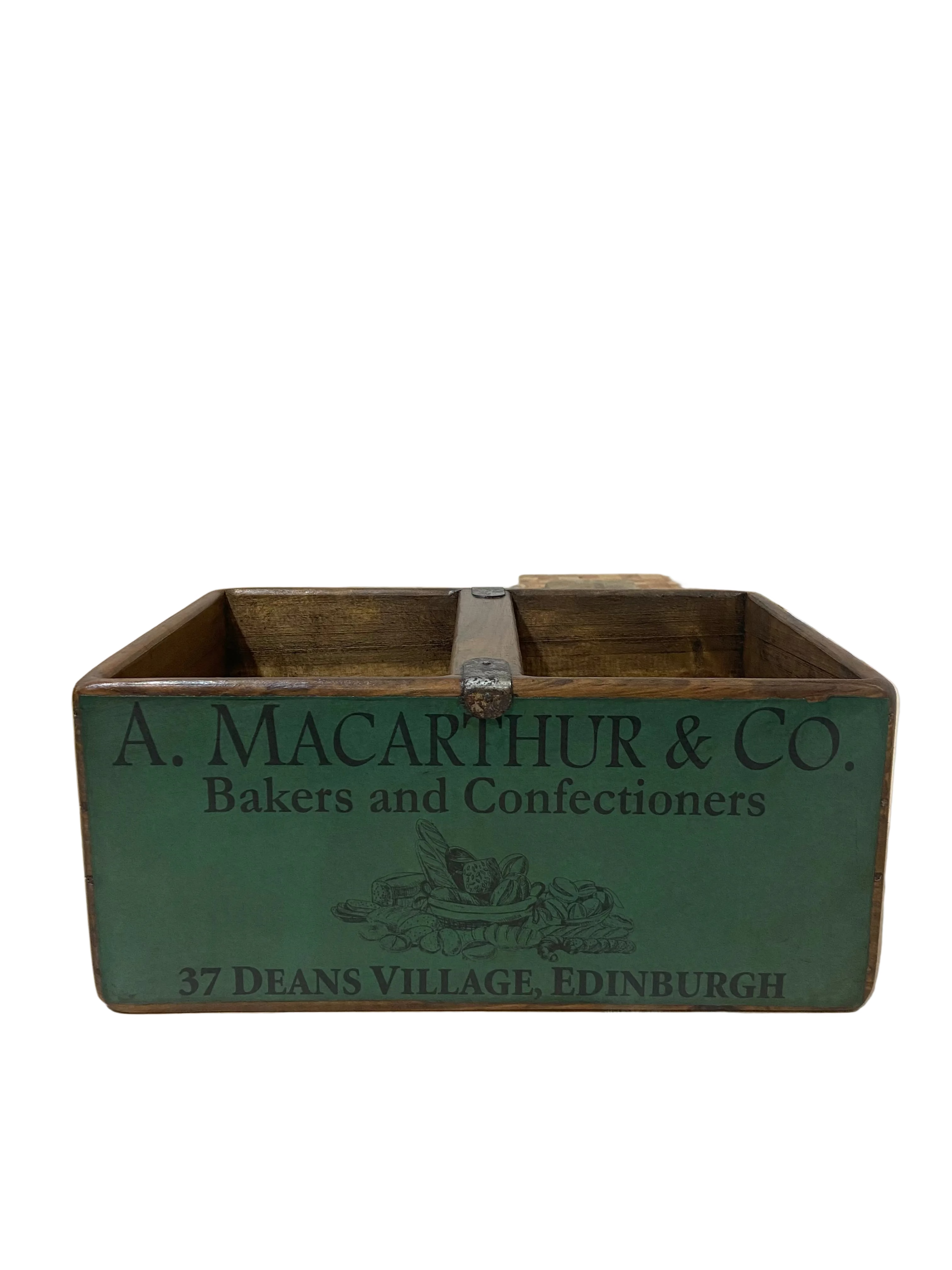 Vintage wooden box with 'A. Macarthur & Co.' branding on a light wooden floor.