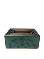 Wooden box with 'The Wee Witch's Bits & Bobs' text on a tiled floor background