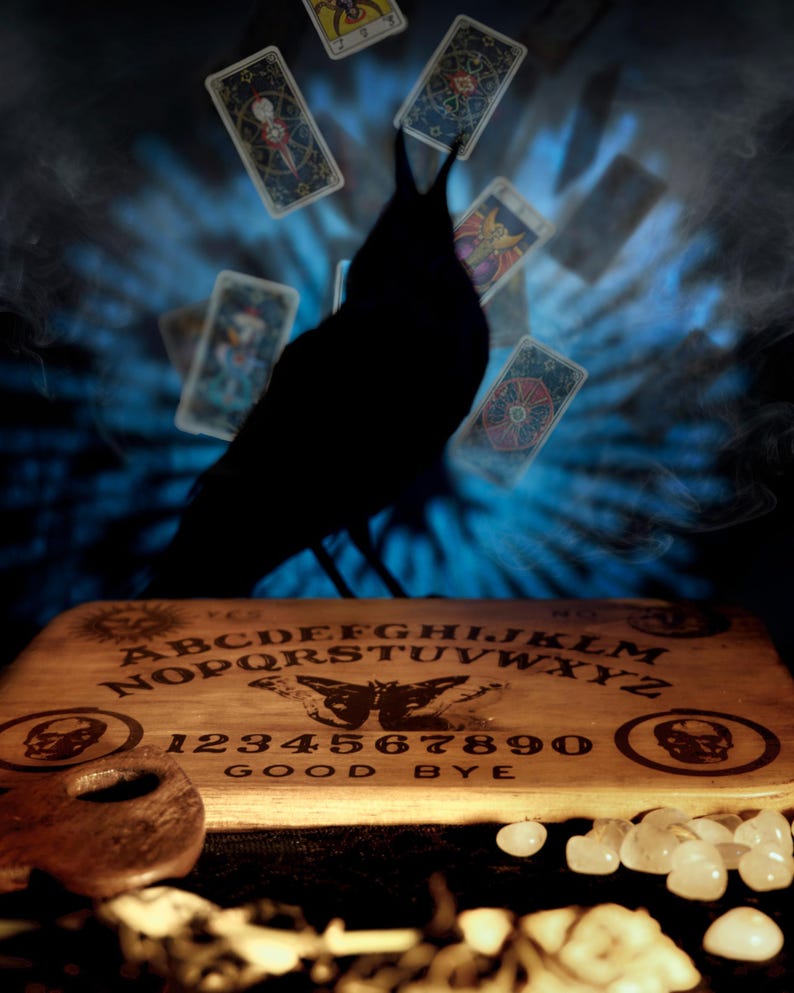 Atlas Moth spirit board with crow and tarot cards